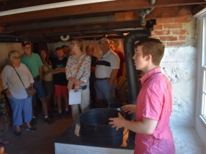 Tour group in the Summer Kitchen at Amish Village