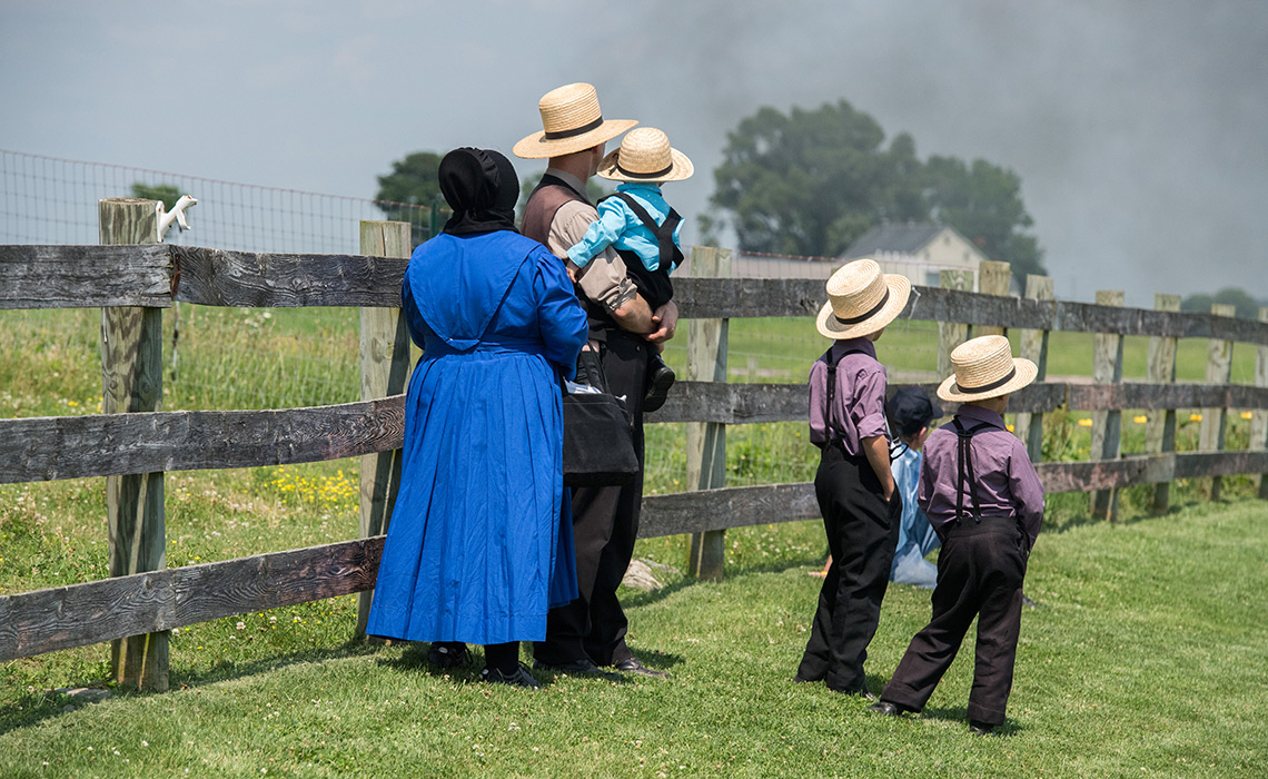 Lancaster, Usa - June 25, 2016: Amish people in Pennsylvania. Amish are known for simple living with touch of nature contacy, plain dress, and reluctance to adopt conveniences of modern technology