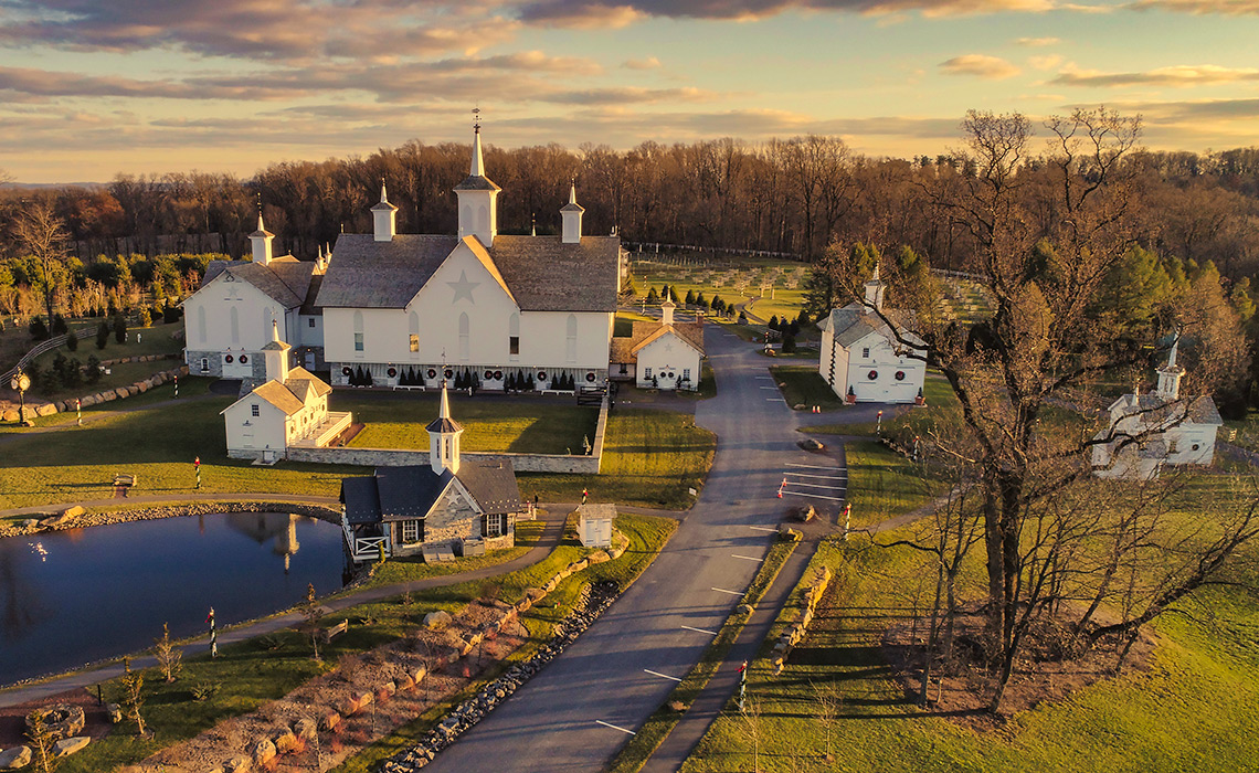 An Aerial View at Sunset of Antique Restored Barns