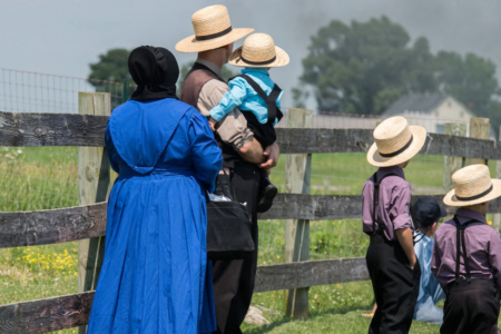 Lancaster, Usa - June 25, 2016: Amish people in Pennsylvania. Amish are known for simple living with touch of nature contacy, plain dress, and reluctance to adopt conveniences of modern technology